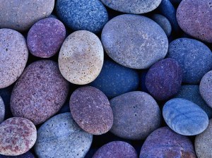 Round beach rocks in shade - photography by Brent VanFossen.